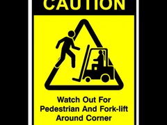 Sign caution watch out for pedestrian and forklift around corner